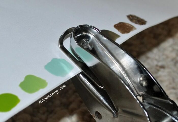 Using a hole punch to make perfect nail polish swatches.