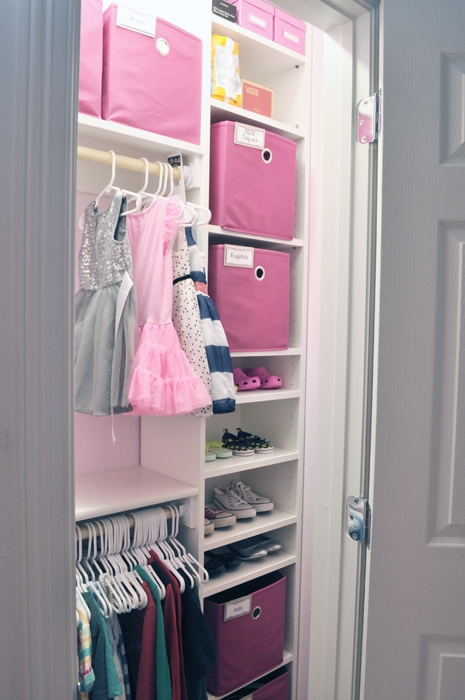 Shared Girls Custom Closet IKEA Hack. See how I used a simple Billy bookcase to transform a bland closet into a fun shared space for two little girls!