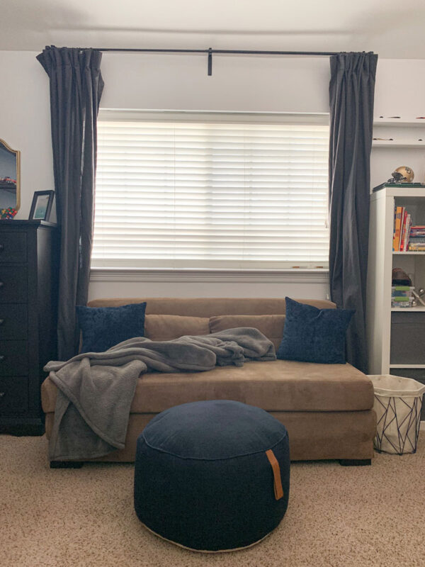It's the Reveal of our One Room Challenge! This tween boy space has come a long way! Come see all of the before & after photos! A tween boy space with a pull out couch for his friends!