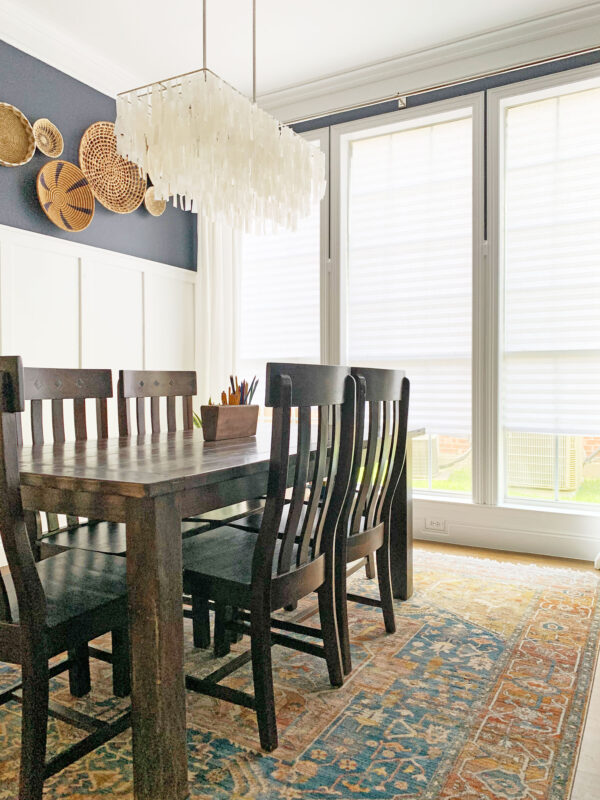 The colorful vintage looking dining room rug makes the remodel complete