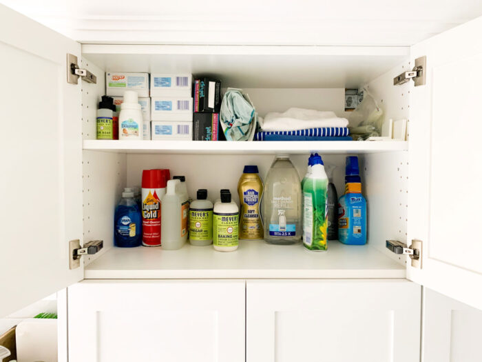 Cleaning supplies backstock organization in our laundry room