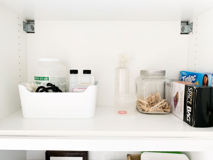 How I organized the cabinet over the sink in our laundry room.