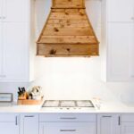 See how I built this DIY Farmhouse Vent Hood Cover for less than $200! Vent Hood | Vent Hood Ideas | Farmhouse | Joanna Gaines | Fixer Upper | DIY | Modern Farmhouse | Kitchen Remodel | Kitchen Renovation | White Kitchen | Rustic Vent Hood | Farmhouse Vent Hood | Farmhouse Vent Hood Ideas | Farmhouse Vent Hood DIY | Vent Hood Over Stove | Wooden Vent Hood