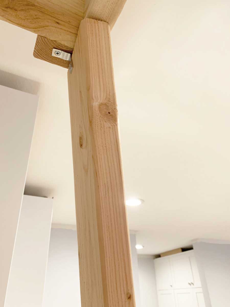 See how I built this DIY Farmhouse Vent Hood Cover for less than $200!