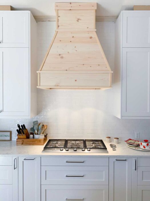 See how I built this DIY Farmhouse Vent Hood Cover for less than $200!