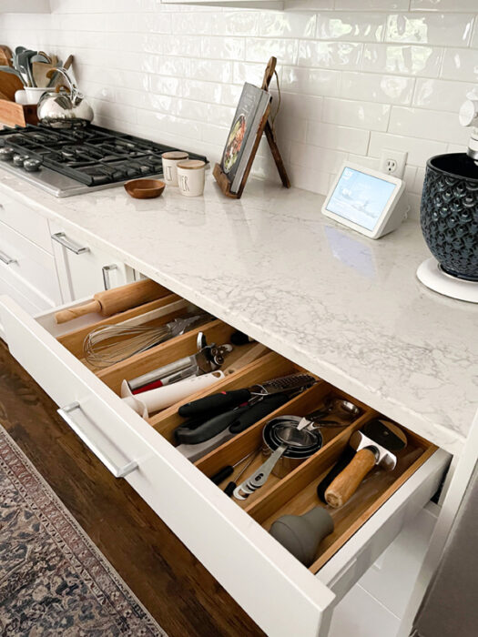 IKEA kitchen drawers with bamboo drawer organizers make for a chic organized kitchen.