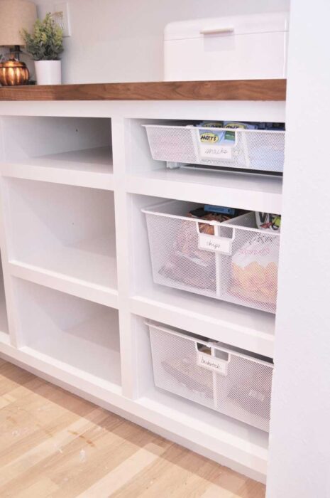 It's the Pantry Reveal! Check out how we designed and built a new walk-in butler's pantry complete with lots of shelving, snack drawers and a countertop!